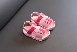 Detailed view of pink soft-soled baby walking sandals for summer