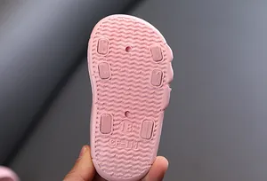 Detail of pink baby sandal sole with anti-slip texture and size 18 marking