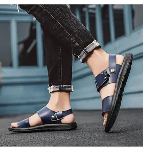 Close-up detail of men's navy blue leather sandals with adjustable straps and rubber soles