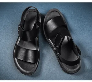 Top-down detail view of premium black men's leather sandals with adjustable straps