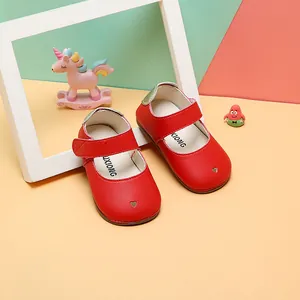 Red baby girl Mary Jane walking shoes with heart cutout detail and soft sole