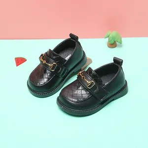 Classic black toddler girls' leather shoes with gold horsebit buckle and soft sole.