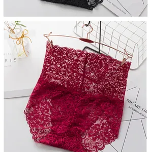 Detailed close-up of high-waisted red floral lace panties on a rose gold hanger