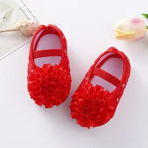 Adorable red baby princess shoes with large fabric flower and soft soles