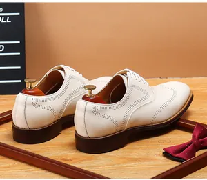 Detailed back view of men's white Brogue leather shoes with elegant business casual style