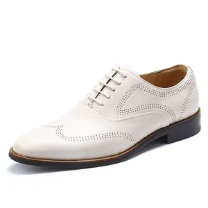 Classic men's white leather Oxford brogue shoes with elegant wingtip detailing for formal events