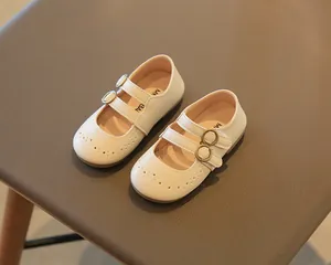 Detailed view of cream-colored girls British style Mary Jane shoes with double buckle straps.