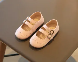 Detailed view of pink toddler girls' Mary Jane shoes with brogue pattern and double straps