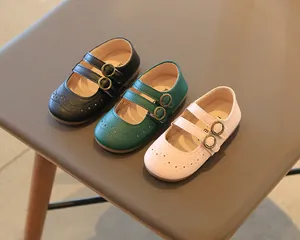 Trio of classic British style children's leather Mary Janes in black, green, and pink colors.