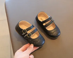 Detailed view of black British style girls Mary Jane shoes with double buckle straps
