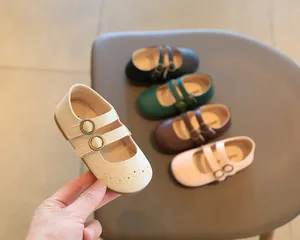 Close-up view of elegant girls' British style Mary Jane flats in assorted colors for toddlers