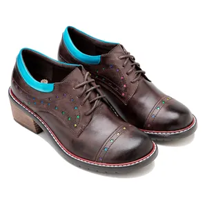 Handmade brown leather lace-up shoes featuring rainbow star cutouts and block heel