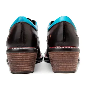 Rear detail showing the chunky stacked heel of dark brown leather lace-up oxford shoes