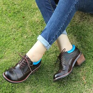 Detailed side view of brown handmade leather chunky heel shoes with star cut-outs