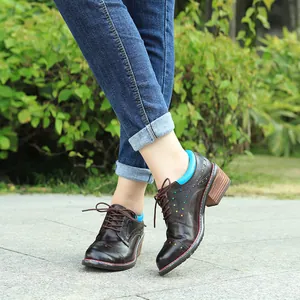 Detailed view of handmade leather oxfords with star cutouts and chunky heels for women.