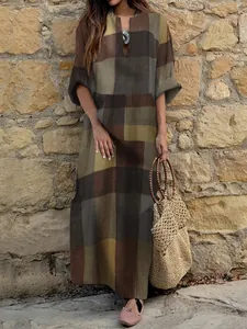 Full-length view of a vintage plaid cotton linen maxi dress in an oversized style.