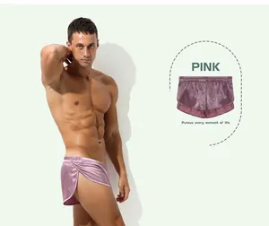 Macro detail view of men's silky pink boxer shorts for sexy home and comfortable sleep wear