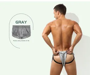 Detailed view of gray silky men's jockstrap boxers with supportive black back straps