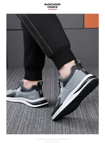 Vista laterale di sneaker casual da uomo grigie e nere con dettagli della suola in schiuma