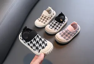 Close-up of children's breathable houndstooth mesh slip-on sneakers in many colors