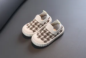 Close-up of children's breathable knit shoes with brown houndstooth pattern