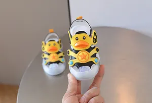 Close-up of baby light-up sandals featuring a cute yellow cartoon duck design.