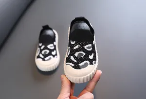 Close-up detail of leopard print breathable knit baby walking shoes with soft rubber sole