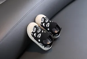 Detail of breathable leopard print baby walking shoes with soft non-slip sole.