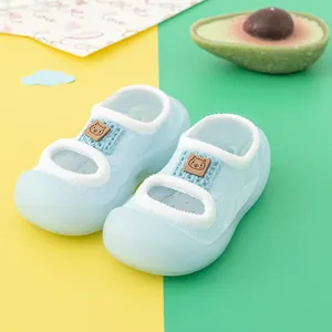 Detailed view of light blue non-slip baby walker shoes featuring soft rubber soles
