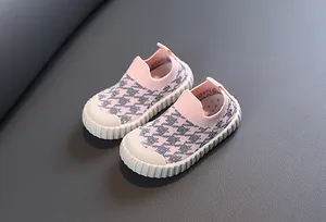 Detailed view of children's houndstooth knit slip-on shoes with breathable mesh