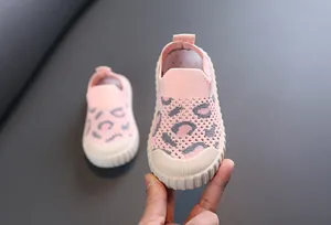 Close-up of pink leopard print infant knit walker shoes with breathable mesh texture