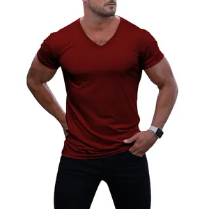 Close-up detail of a men's maroon V-neck quick-dry athletic T-shirt on a muscular model.
