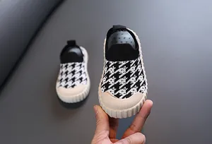 Close-up view of breathable houndstooth pattern mesh sneakers for toddlers and kids