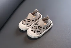 Detailed macro view of leopard print toddler walking shoes with breathable knit fabric