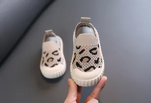 Detailed macro view of breathable leopard print baby walking shoes with flexible soft soles