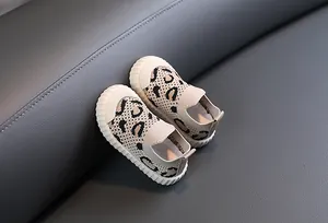 Close-up of leopard print baby walking shoes with breathable mesh and soft rubber sole