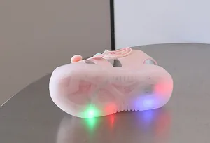Close-up of pink toddler sandals featuring colorful LED light-up translucent soles