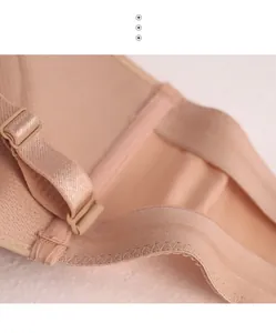 Close-up of breathable nude bra lining and strap attachment detail.