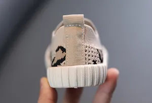 Close-up of breathable knit baby walker shoes with leopard pattern and ribbed sole