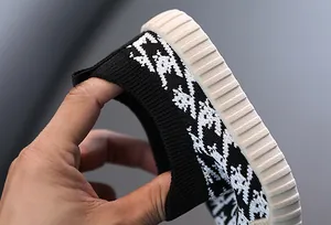 Detailed macro view showing the flexible elastic collar and breathable mesh fabric of kids sneakers