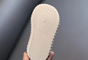 Close-up detail view of durable anti-slip rubber sole with size 23 mark for kids sneakers