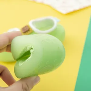 Close-up of soft and flexible lime green baby walking shoe showing high elasticity