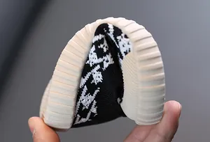 Flexible sole detail of children's breathable black and white mesh sneaker