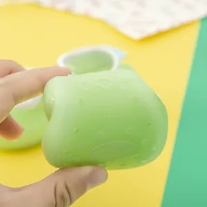 Close-up showing the soft and flexible anti-slip green sole of baby indoor floor socks