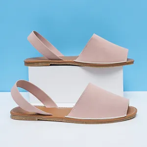 Dusty rose flat slingback sandals with peep toe design on a minimalist background
