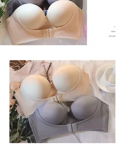Close-up detail of seamless strapless push up bra with front buckle in beige and grey