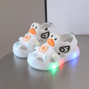 White toddler LED light-up sandals with cute cartoon duck design and soft sole