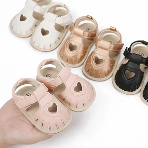 Close-up view of soft-soled baby summer sandals with heart-shaped cutouts in various colors