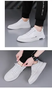 Detailed view of trendy white men's casual sneakers with lace-up style and fashion print