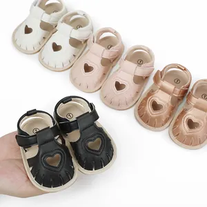 Variety of baby summer sandals with heart cutouts in white, pink, gold and black